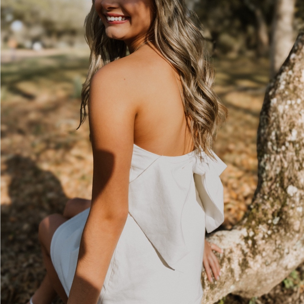 White altar’d state dress with bow in back!